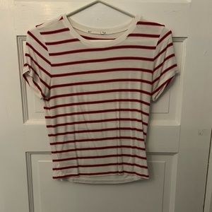 A red, black, and white striped women’s shirt
